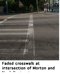 Image of faded crosswalk at intersection of Morton and Norfolk streets